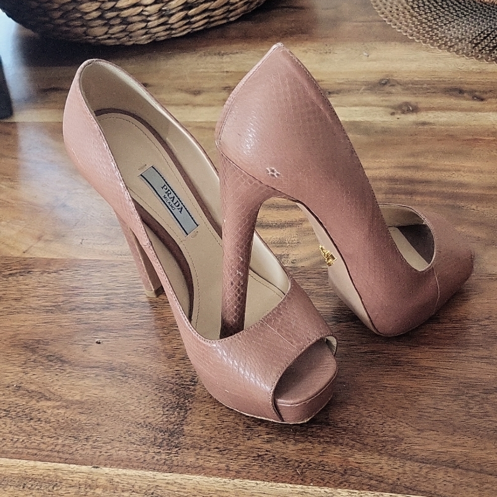Prada open toe Pumps.  Very little scuff marks. Missing the "P" on one of them.